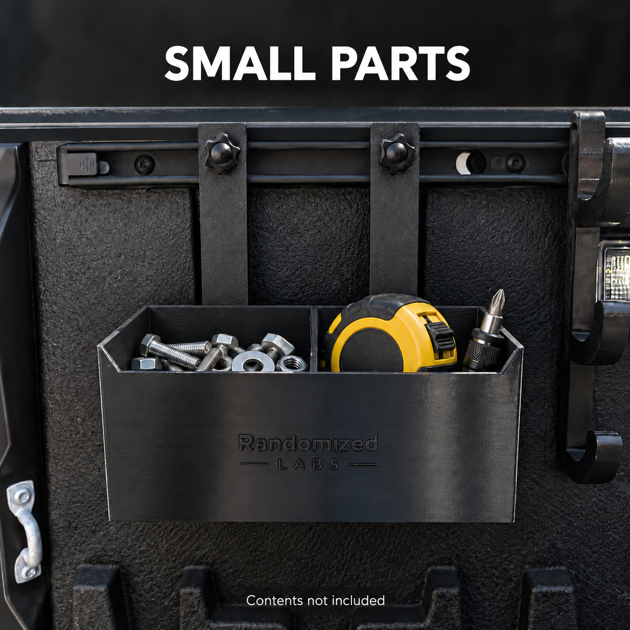 Rail-mounted Organizer Box holding hardware, a tape measure and driver bits; contents not included